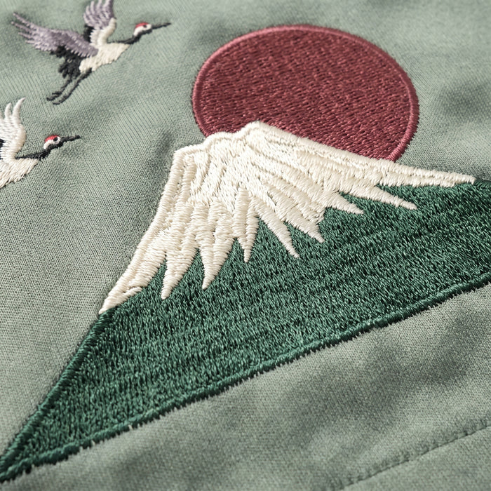 Sage green Sukajan shorts with Mount Fuji and crane embroidery