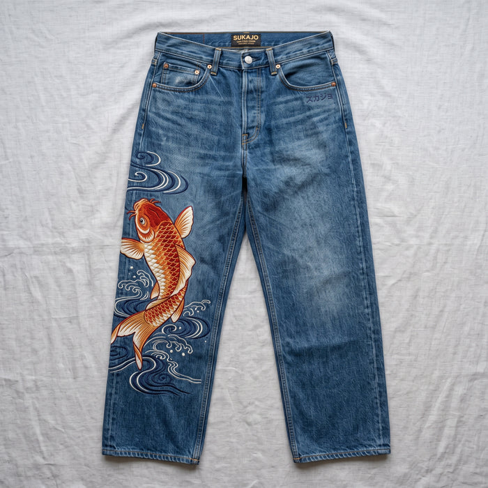Japanese embroidered jeans with orange koi fish and wave artwork
